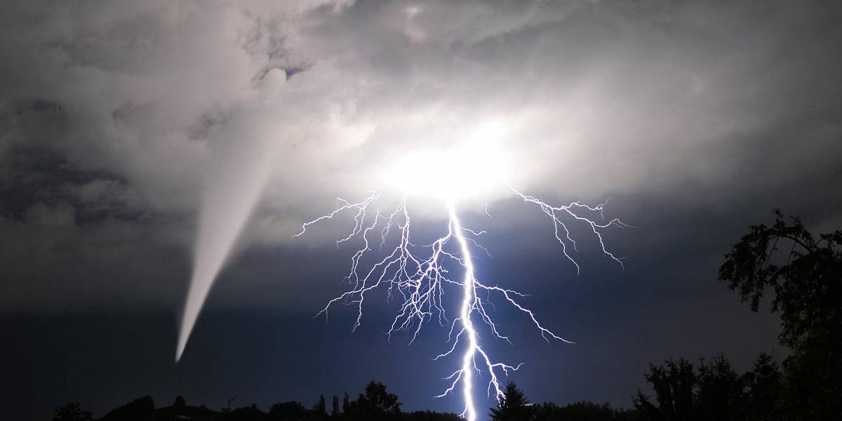 Massive lightning bolt, and a tornado, are spawned from a single cloud